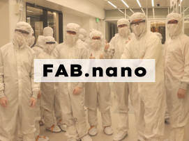 A group of people stand in bunny suits in MIT.nano's cleanroom.