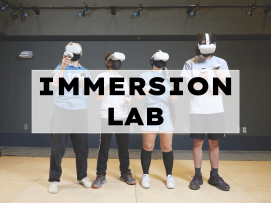 A group of students wear VR headsets in the Immersion Lab